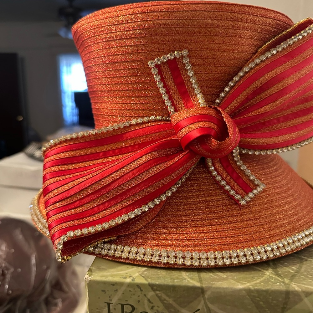 Elegant Orange Hat with Red Ribbon